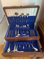 Chest open showing full complement of flatware in two tiers
