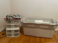 Large tote beside three-drawer unit topped with thread spools