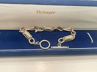 Bracelet in open Dynasty box showing link design and toggle clasp