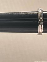 Side view of sterling silver ring showing band profile and inlay