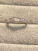 Top view of sterling silver ring showing marquise crystal and split band