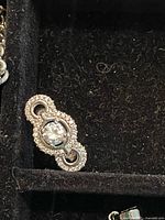 ring in jewellery box displaying design and central stone