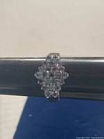 Front view of sterling silver ring with tanzanite cluster