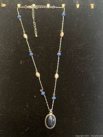 Full necklace showing pendant, beads, extender chain