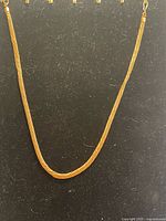 Full view of rose gold twisted chain necklace