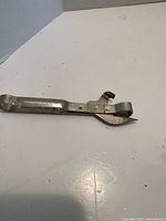 Full view of metal can punch bottle opener