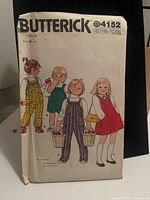 Front of Butterick 4152 envelope showing illustration of garments and size range