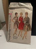 Front of Simplicity pattern 5040 showing illustrations and size information