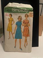 Front of Simplicity 9383 pattern envelope with 1970s dress illustrations
