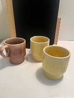 Three mugs side by side showing colors and glaze