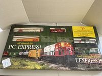 Top view of the original box showing the limited edition PC Express electric HO scale train set with multiple train cars visible through plastic window