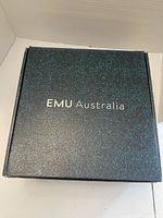 Closed original box with EMU Australia branding