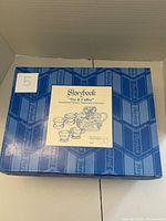 Closed Storybook branded box showing lot packaging and brand