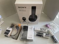 Sony MDR-RF995RK stereo headphones in original box with various accessories.