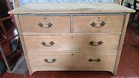 Front view of pine dresser showing four drawers and brass pulls