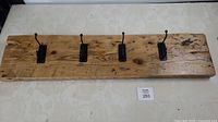 Front view of full 42-inch reclaimed wood coat rack with four hooks