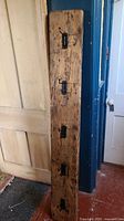 Full view of 68-inch reclaimed wood coat rack with five hooks