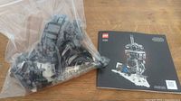 Bagged partially assembled Imperial Probe Droid pieces beside instruction manual