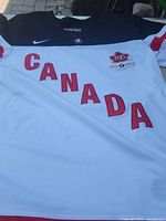 Front view showing CANADA lettering, crest, Nike logo