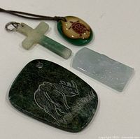 Four pendants arranged to show front detail