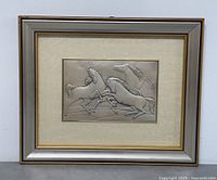 Frontal image of the framed embossed silver horse wall art showing the full piece including frame.