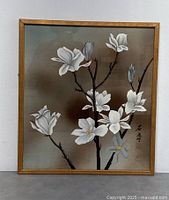 Frontal view of framed wall art showing full floral composition and frame detail.