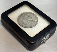 1932 Latvian 5 Lati Silver Coin in protective black display case with clear top.