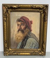 Frontal view of the complete framed portrait showing subject and frame