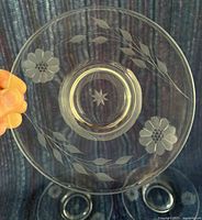 Front view of one saucer showing Cornflower etching