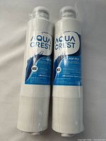 Two sealed Aqua Crest AQF-FF27 filters side by side
