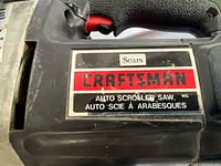 Close-up of Craftsman Auto Scroller model label on tool body