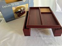 Tray on its legs with box in background