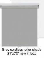 Stock-style image of grey cordless roller shade fully extended