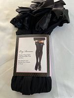 Front view of packaged Leg Avenue thigh-highs