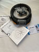 Cable lock, mounting bracket in bag, instruction manual, bracket diagram booklet, Via Velo registration card
