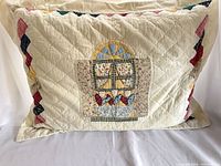 Front view of quilted sham over pillow showing entire design