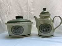 Front view of teapot and lidded crock showing pattern and lids