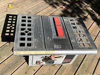 Top view of Shopcraft 10" table saw showing table surface, throat plate, fence rail