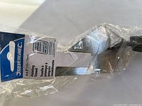 Trowel blade and retail header card visible in sealed plastic