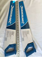 Two packaged Silverline saws beside ruler for scale