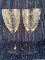 Front view of both etched wine glasses standing side by side