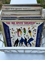 Top view showing multiple LPs with The Ink Spots ‘Greatest’ Vol.3 at front in white plastic crate