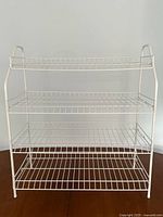 Front view of white 4-tier wire shelf