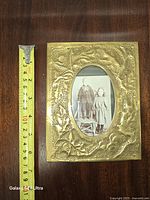 Front view with tape measure showing approx 6.5 in height, 5.5 in width