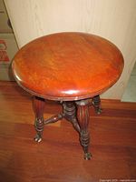 Top view of round wooden seat showing finish condition