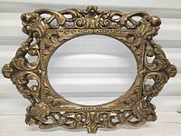 Front view of entire ornate oval frame