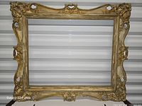 Full view of ornate gilt frame front