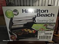 Front of retail box showing Hamilton Beach Searing Grill model 25361C