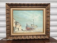 Framed oil painting full view showing carved wood frame