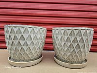 Front view of both diamond pearl ceramic planters on saucers